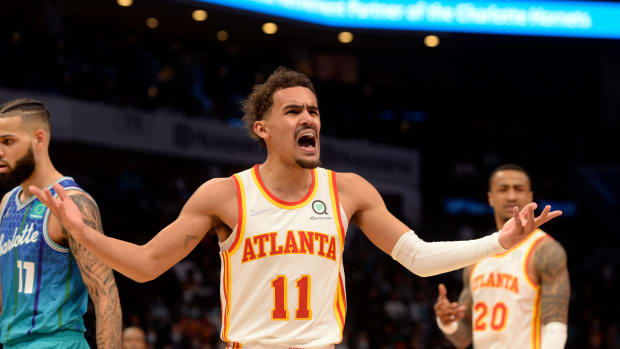 Trae Young yells at a referee.